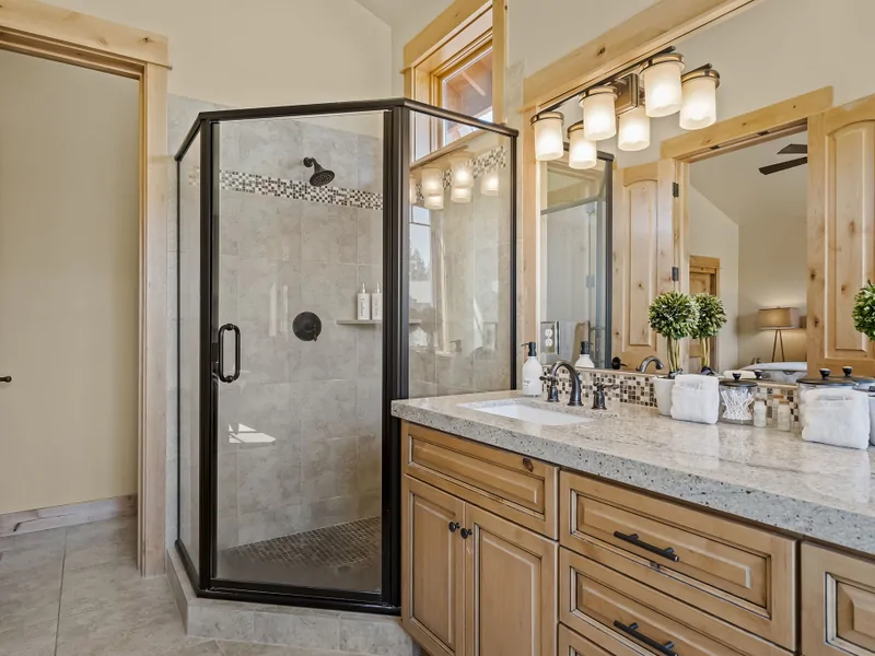 Main Floor: Primary Suite : ensuite with a walk-in shower and double vanity