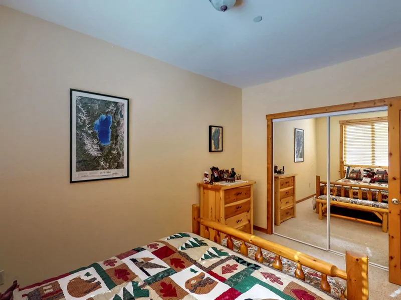 Bedroom with tan walls and closet: Truckee Cinnabar Vacation Retreat