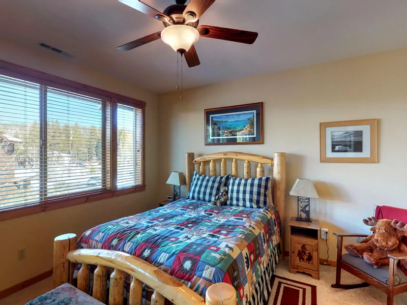 Bedroom with one bed~ nearby bathroom and ceiling fan: Truckee Cinnabar Vacation Retreat
