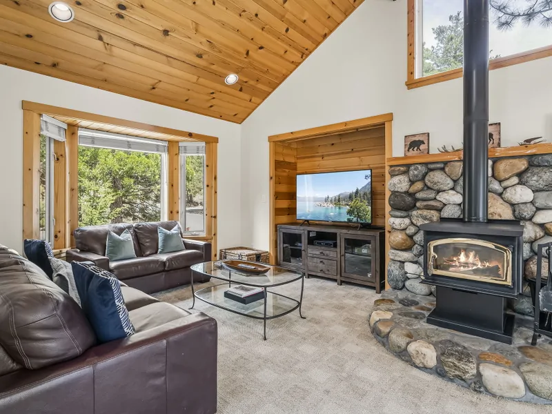 Living Room with wood-burning fireplace, and rustic river-rock hearth
