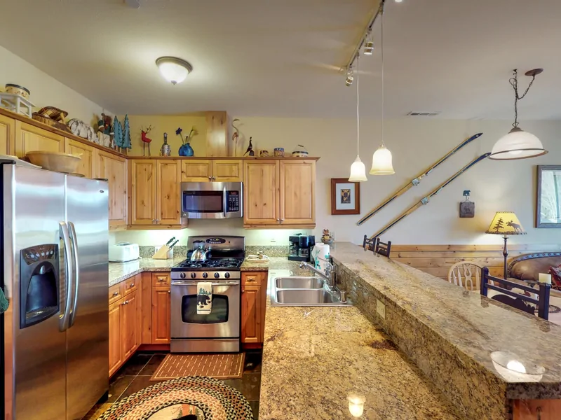 Kitchen with countertops~ oven and fridge: Truckee Cinnabar Vacation Retreat