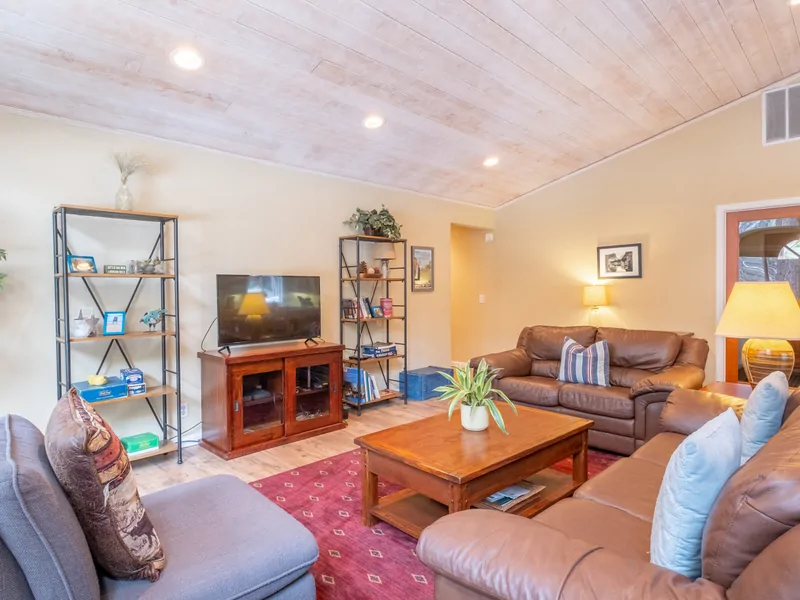 Living Room to Entry: Three Pines Family Cabin
