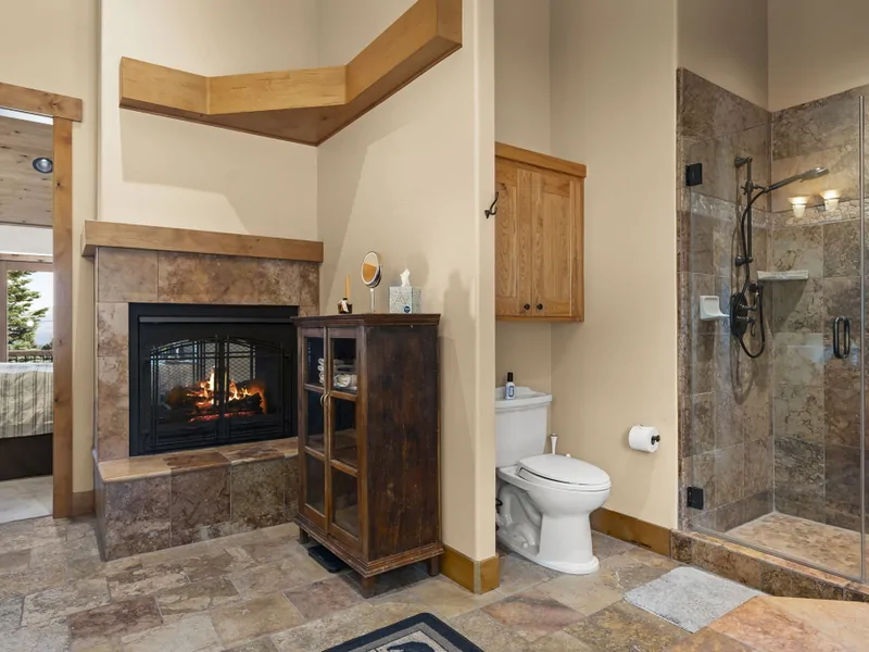 Dual Fireplace in Primary Bath - Moonridge Lodge